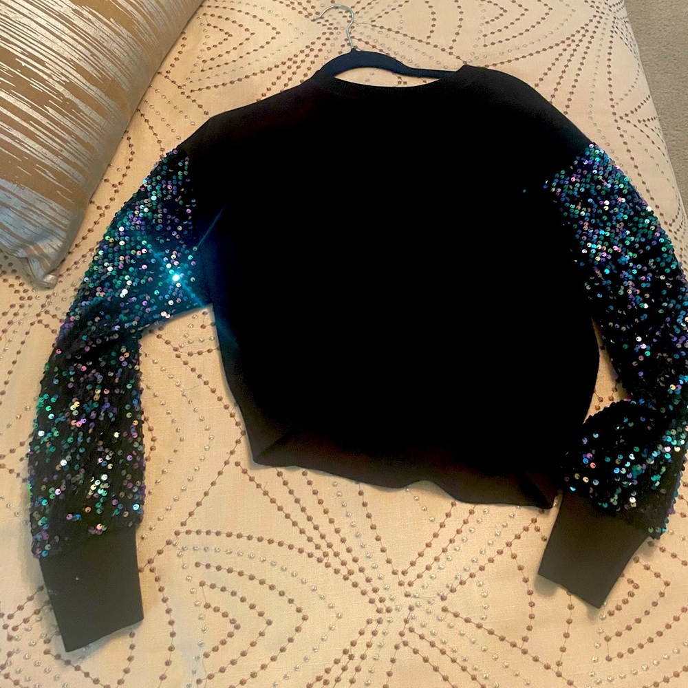 Black sweater with sequin arms worn one time